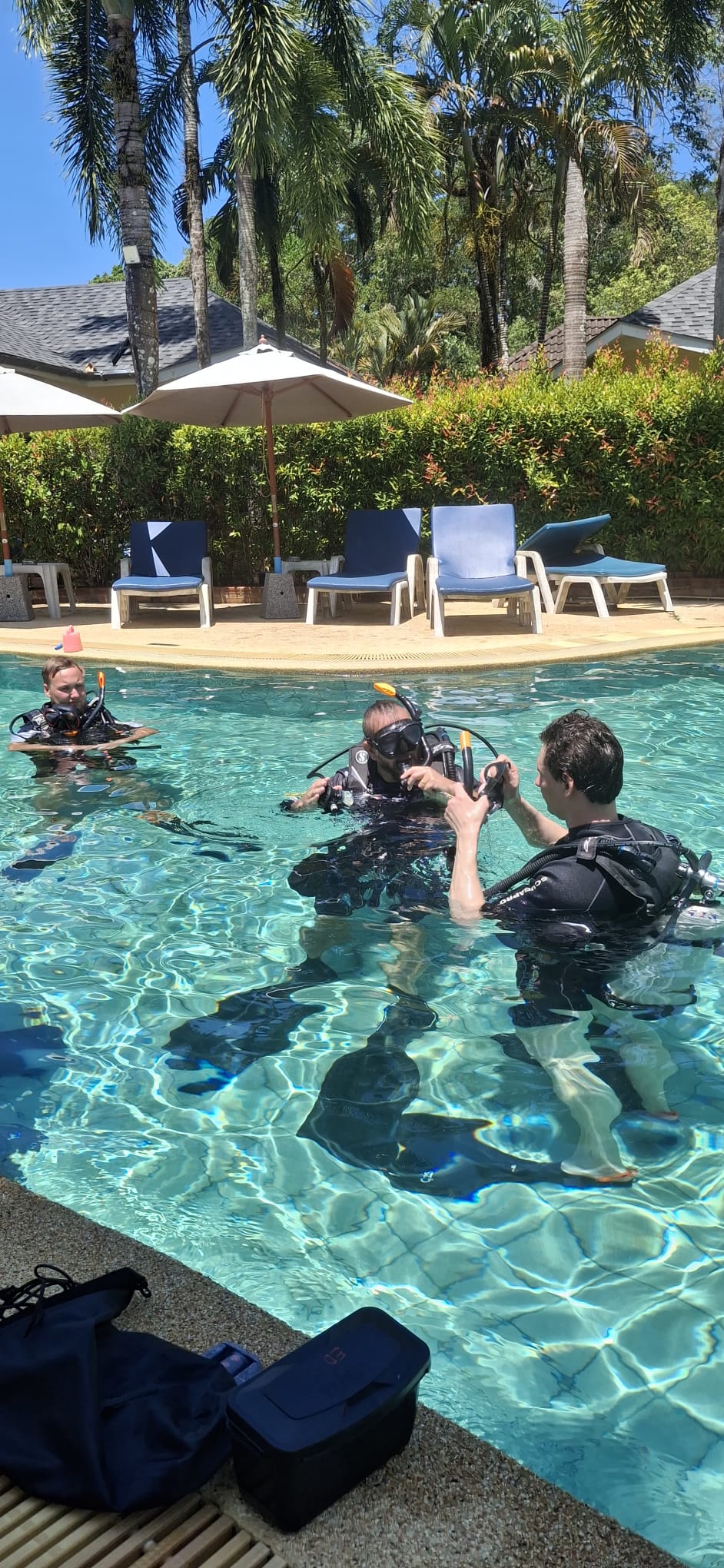PADI IDC candidate demonstrating confined-water skills in the pool
