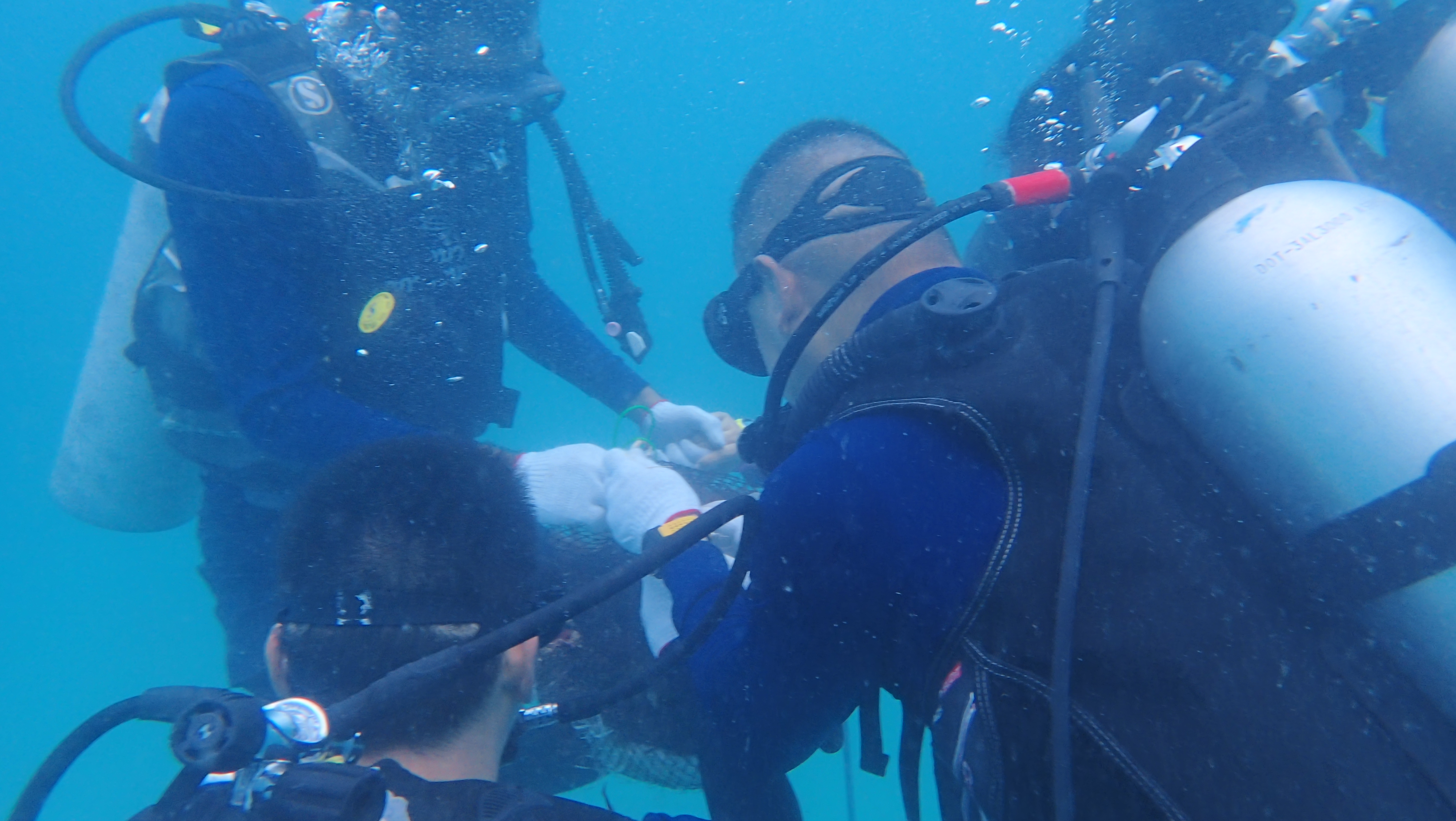 Divers completing an underwater instructor-development exercise